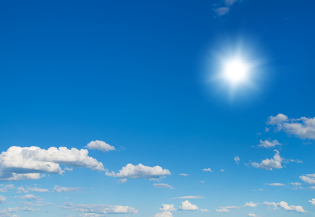 Shining sun at clear blue sky with copy spaceの写真素材