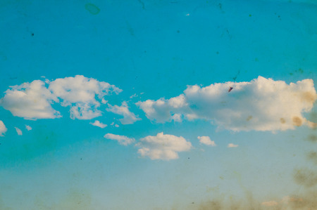 white fluffy clouds in the blue skyの写真素材