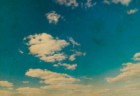 white fluffy clouds in the blue skyの写真素材