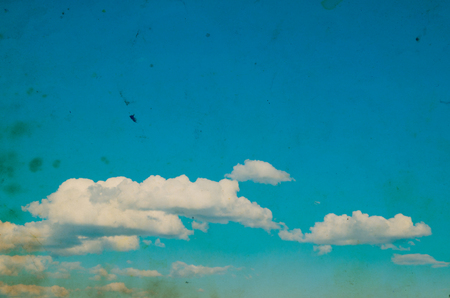 white fluffy clouds in the blue skyの写真素材