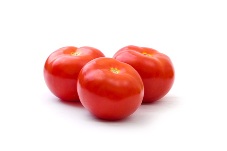 red tomato isolated on whiteの写真素材