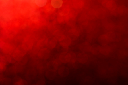 Defocused Bokeh twinkling lights Vintage background. Festive background with natural bokeh and bright golden lights.の写真素材