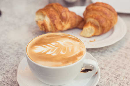 Cappuccino croissant in a French bakkery and coffe-shopの写真素材