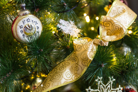 decorated christmass tree with christmass lights, bubbles and ribbons