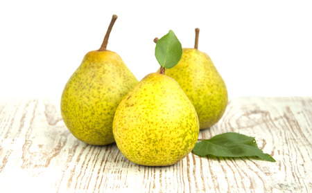 Ripe and fresh pears on a wooden backgroundの写真素材