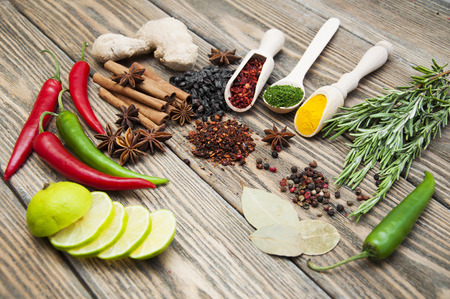 Mix of spices and lime on the wooden の写真素材