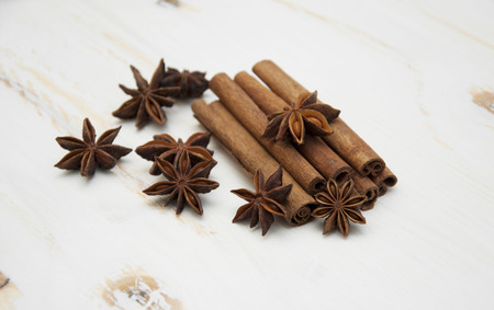 Spices set.Cinnamon stick,star anise on a white wooden backgroundの写真素材