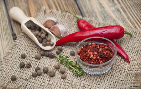 Red peppers on dark wooden background