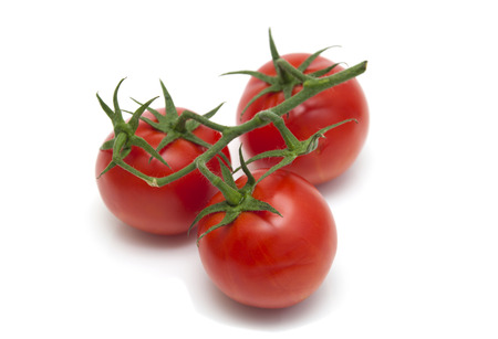 Fresh ripe tomatoes isolated on white backgroundの写真素材