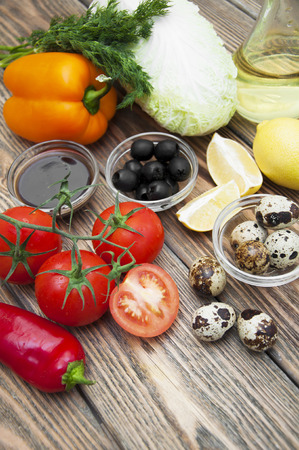 Ingredients for fresh salad on a wooden backgroundの写真素材