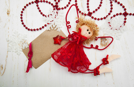 Cute Christmas angel over old wooden backgroundの写真素材