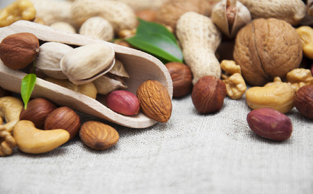 Mixed nuts on a wooden background