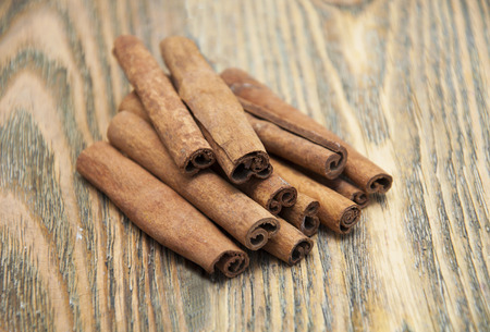 Spices set.Cinnamon stick on a wooden background