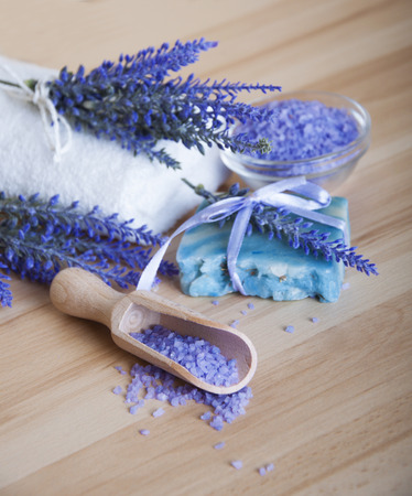 Dry lavender,natural soap,salt on a wooden board, hygiene items for bath and spaの写真素材