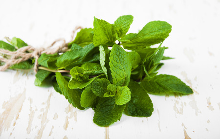 Bunch of mint on a wooden background. Peppermintの写真素材