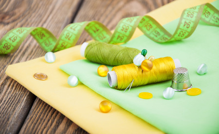 Set of different sewing accessories,fabrics and thread spools