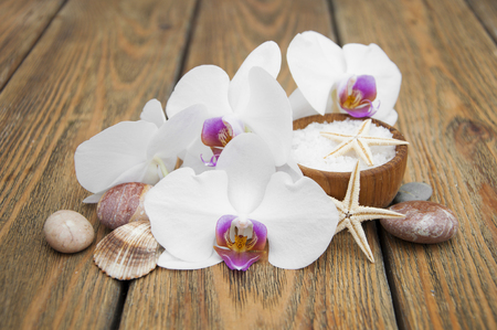 Spa composition with orchids on wooden backgroundの写真素材