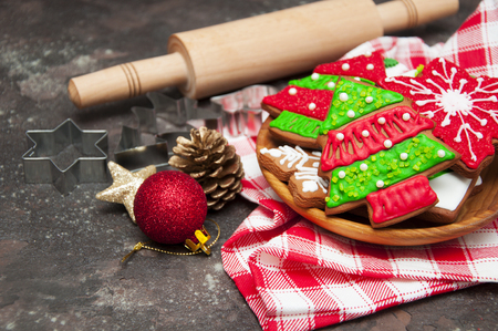 Christmas ginger cookies with christmas baubles on a stone backgroundの写真素材