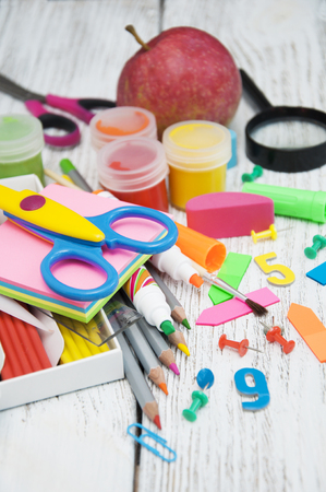 Bright school stationery on old wooden tableの写真素材