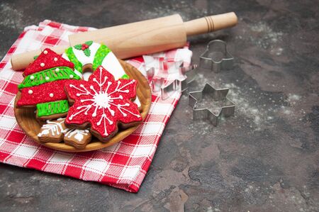 Christmas ginger cookies with christmas baubles on a stone backgroundの写真素材
