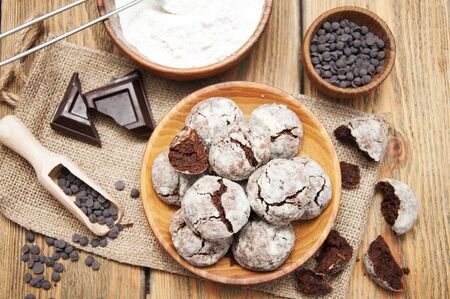 Crackled chocolade cookies on a old wooden backgroundの写真素材
