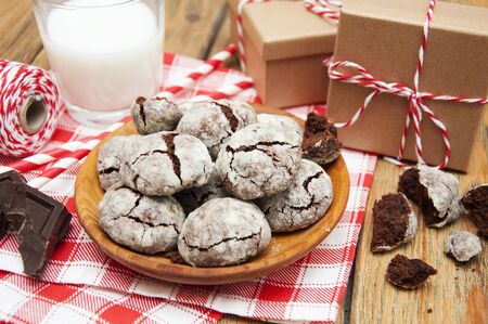 Crackled chocolade cookies on a old wooden backgroundの写真素材