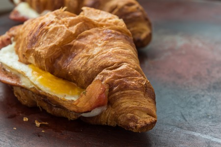 Fresh baked ham and cheese croissant with honey mustard glazeの写真素材