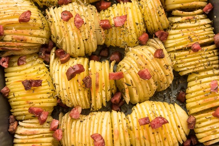 Homemade crispy potato roast with hunting sausages