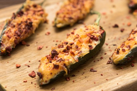 Hot jalapeno baked with cheese and sauceの写真素材