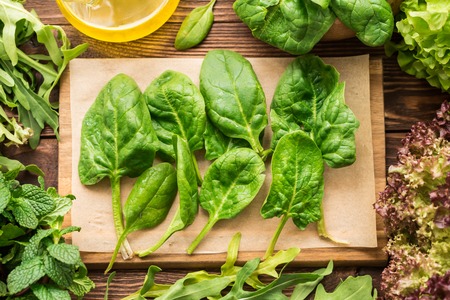 Fresh spinach, arugula and other greens for healthy garnishの写真素材