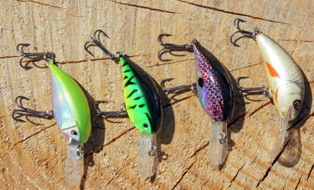 Fishing lure on wooden background の写真素材