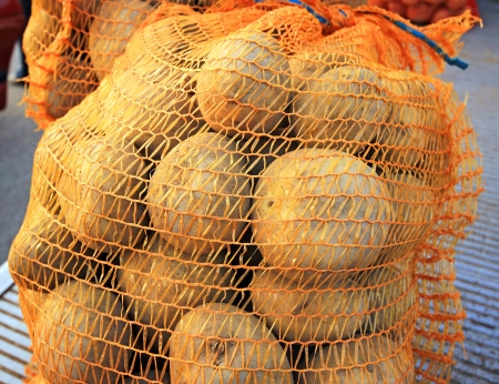 Potatoes in bagsの写真素材