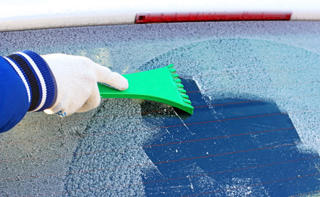 Cleaning frozen car window from the ice