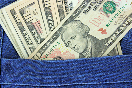 dollars in pocket of jeans