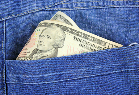 dollars in pocket of jeans