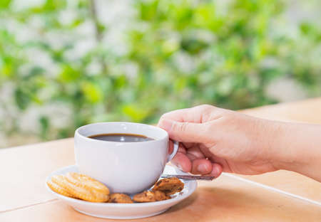Morning coffee in the front gardenの写真素材