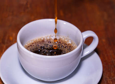 Make Americano coffee in a white cupの写真素材