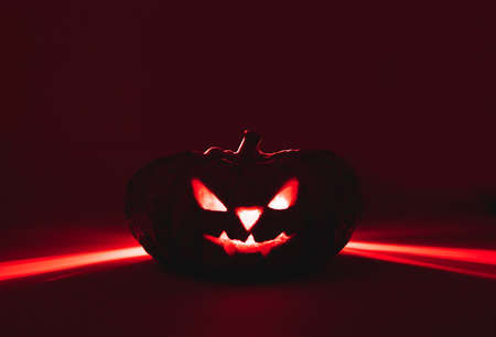 Jack O'Lantern from pumpkin and red light in happy haloween.の写真素材