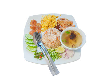 Fried rice mixed with a side dish, shredded omelette, long bean, red onion, chili, Chinese sausage, sweet pork, shimp past and sliced ââlemonの写真素材