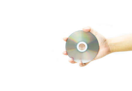 A dvd disc in the hands of a man handing over technology