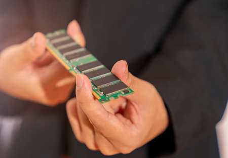 Businessmen upgrade their computers to speed up the competition on isolate white background.の写真素材