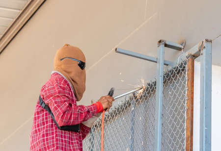 Welding steel structure wire mesh sparks point in factory.