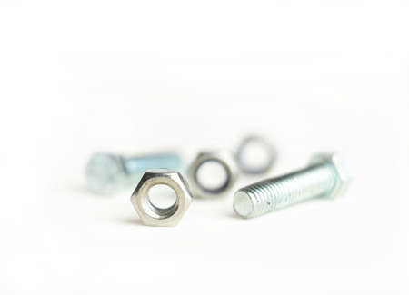 Metal nut,bolt and out of focus on isolate white background.