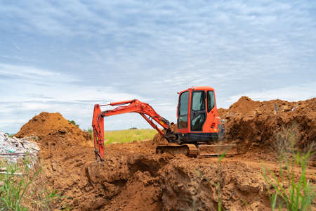 Mini Excavator dug soil back factory for create utility support .