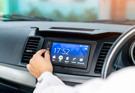 The man using car audio stereo system.Travel concept.