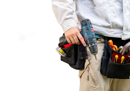 Close up image of technician with tool belt around waist on isolate white background.の写真素材