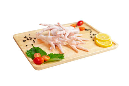 Chicken feets on the market for used in various cooking isolate white background.の写真素材