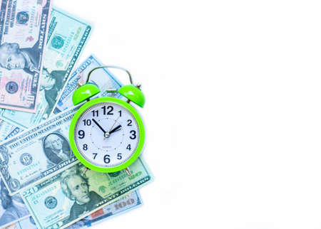 Alarm clock and dollars a time to make money. Concept management rich and time.の写真素材