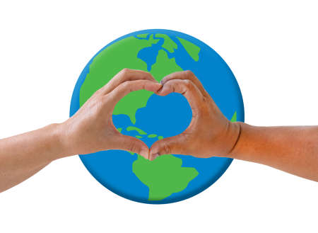 Female and male hands making sign Heart by fingers on earth background. Friendship concept or save the world..の写真素材