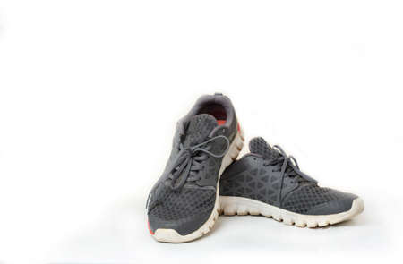 Used gray sneaker everyday running on isolater white background.の写真素材